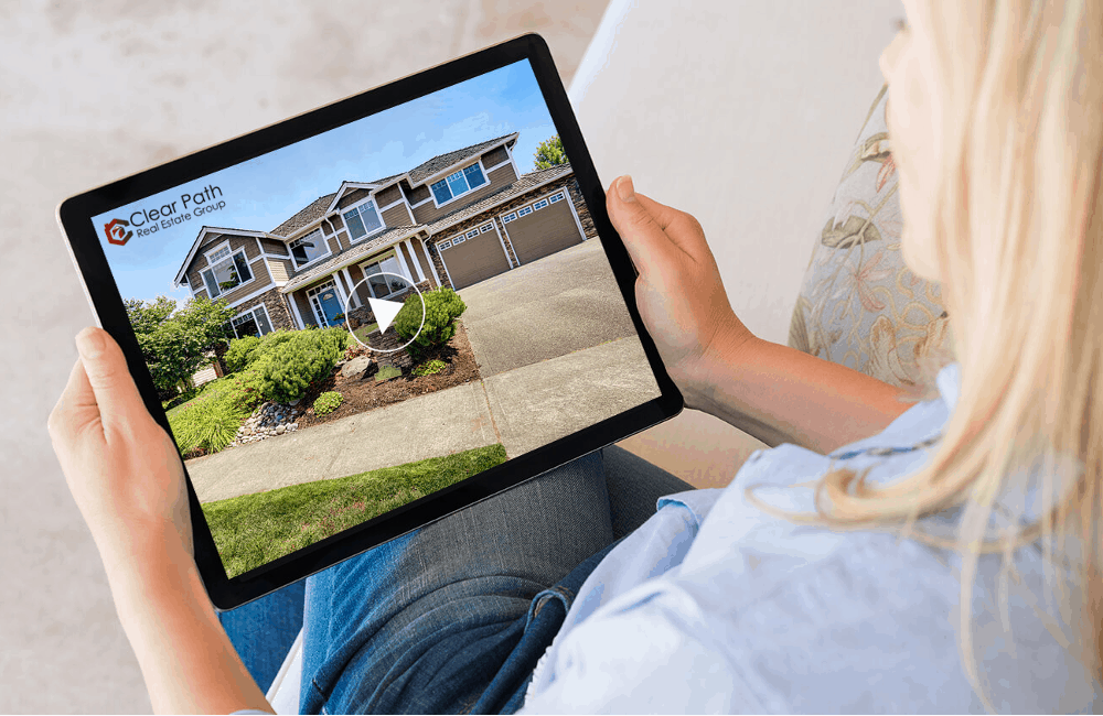 A woman watching a Real Estate Video on Tablet